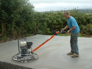 T W McCarten & Son have most of their own plant and equipment. The photo shows Clive McCarten using power-floating equipment.